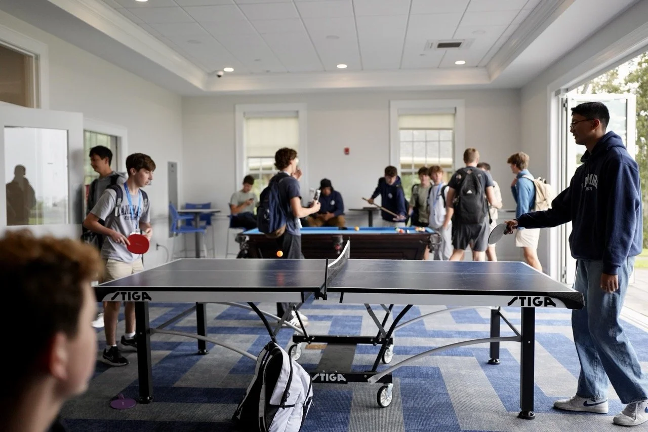 students playing ping pong